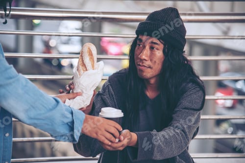 Preview: Woman helping hands to homeless people poverty beggar man holding hands asking for money