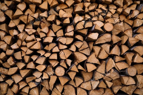 Preview: Stacked firewood as background. Heating house in winter