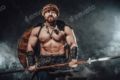 Preview: Shirtless viking armed with spear poses in smokey background