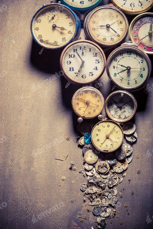 Preview: Aged clocks in pile
