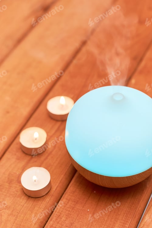 Preview: Aroma oil diffuser on table at home. Aromatherapy concept
