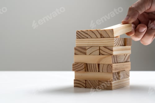 Preview: Hand of engineer stacking wood blocks