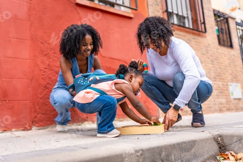 Preview: African three generation family playing with toys in the city