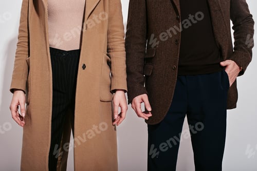 Preview: They belong together. Well-dressed couple posing in studio. Close up