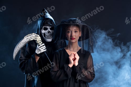 Preview: young female dressed in all black on the dark background devil death funeral grim reaper