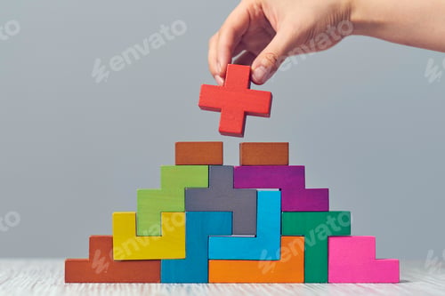 Preview: Hand arranging wood cube stacking as step stair.