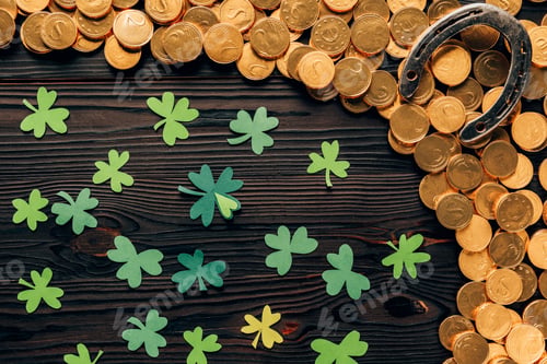 Preview: top view of shamrock, golden coins and horseshoe on wooden table, st patricks day concept