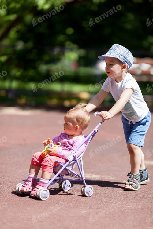 Preview: Boy pushing sister in a stroller