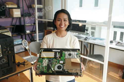 Preview: Woman Showing Broken Laptop At Camera