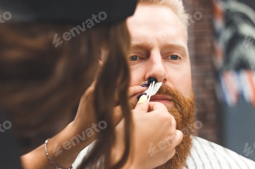 Preview: Removing hair from the nose with wax in barbershop, male beauty and care concept