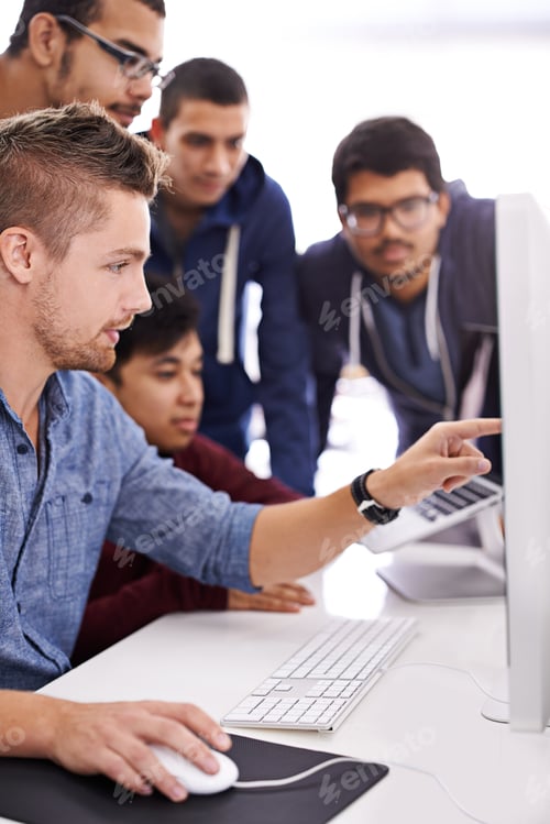 Preview: Shot of a group of colleagues working together with a computer in an office