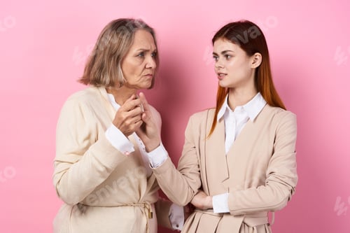 Preview: Mom and daughter holding hands caring family together love pink background