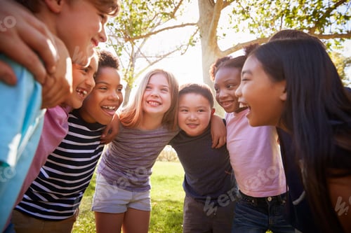Preview: Group of schoolchildren embrace standing in a circle