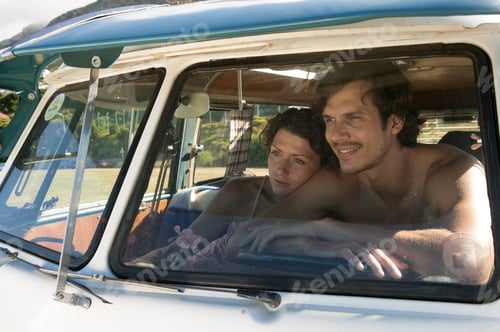 Preview: View through windscreen of couple in campervan