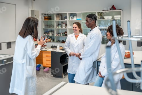 Preview: Medical students listening to teacher explaining anatomy in university laboratory