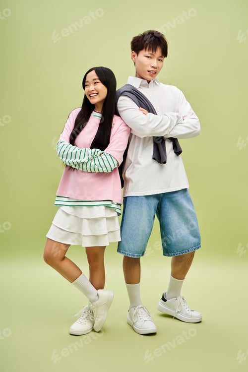 Preview: Stylish couple showcases modern love and fashion in a vibrant green setting