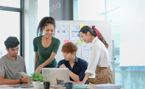 Preview: Group of young asian business people in smart casual wear working together in creative office
