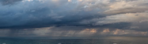 Preview: Cloudscape during a dark, rainy and colorful morning sunrise