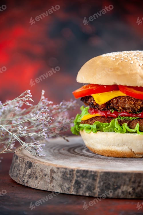 Preview: front view meat burger with cheese tomatoes and salad on a dark background sandwich meal bun
