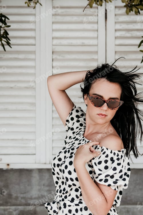 Preview: Stylish Woman Posing with Polka Dot Outfit