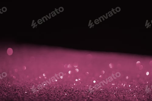 Preview: blurred purple glowing glitter on black background