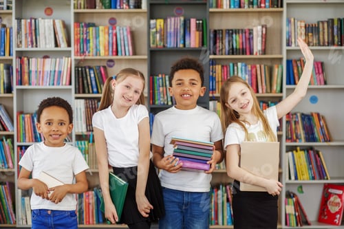 Preview: Four children holding stack of books in library. Multiethnic classmates having fun. Back to school.
