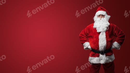 Preview: Cheerful Santa in festive attire ready for Christmas on red background