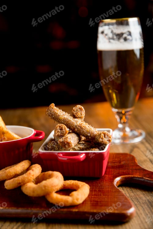 Preview: Sticks, fried onions and fried tomatoes with sauce