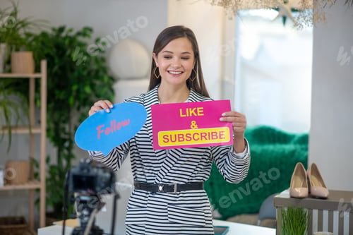 Preview: Delighted young female blogger attracting new followers