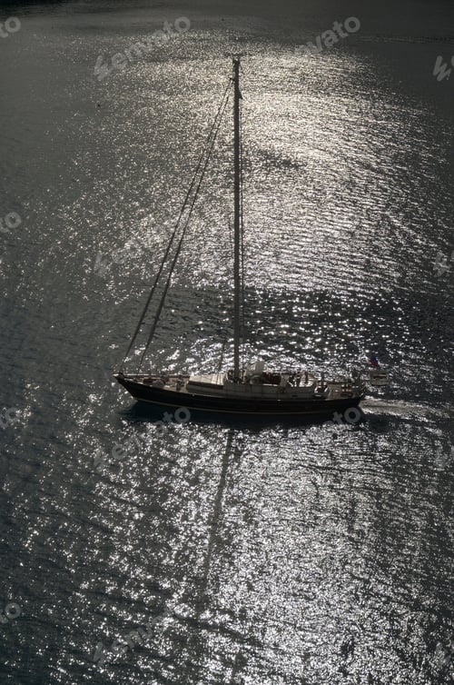 Preview: Closeup of a sailboat sailing along the shoreline of the coast of Grand Cayman