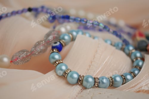 Preview: Jewelry displayed on fabric in soft colors and simple design