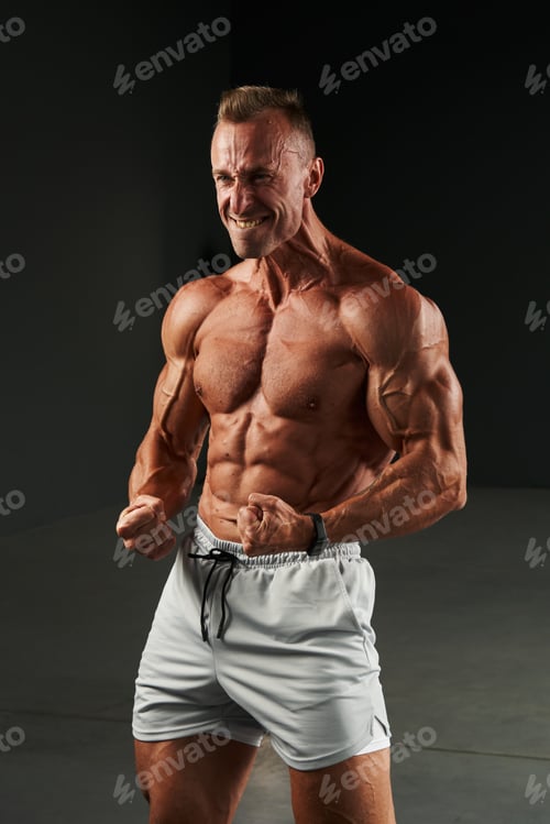 Preview: from strong tension in the Caucasian athlete, large veins appeared on his arms and neck. ideal