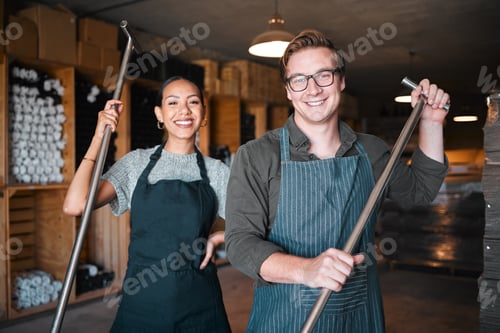 Preview: Wine making workers with press tool or equipment inside a cellar, winery or distillery warehouse wi