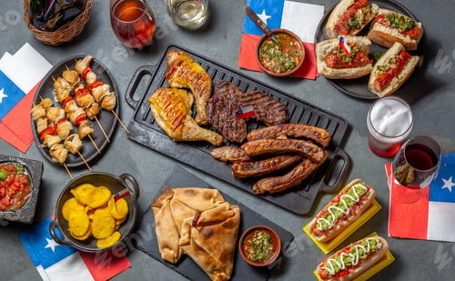 Preview: Chilean independence day table with traditional festive food for fiestas patrias. Dish and drink on