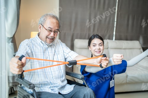Preview: Asian Disabled senior elderly man on wheelchair doing physiotherapist with support from nurse.