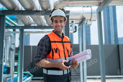Preview: Engineer Inspecting Industrial Pipes on Rooftop