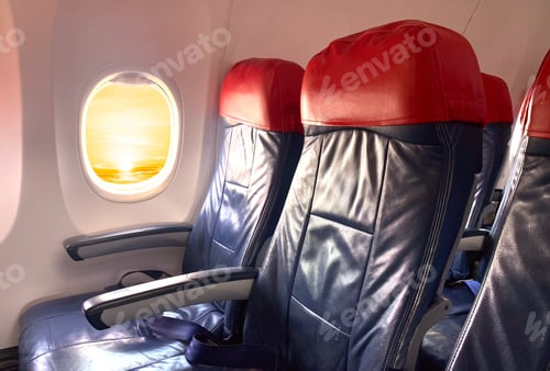 Preview: Window and seat inside Plane flying on sunset in the morning flight Airplane well space for text