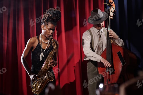 Preview: Young Black Woman and Young Caucasian Man Performing Jazz Music on Stage