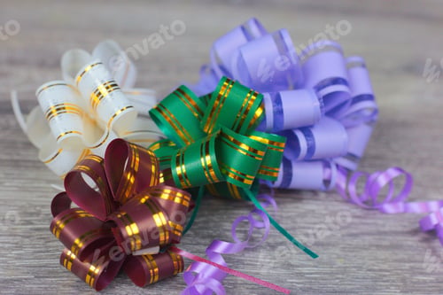 Preview: Closeup shot of colorful ribbons on a wooden table