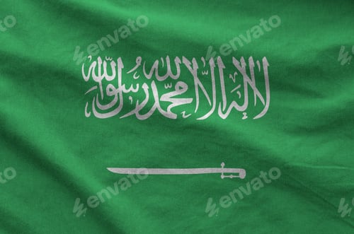 Preview: Saudi Arabia flag depicted on folded wavy fabric of old cloth