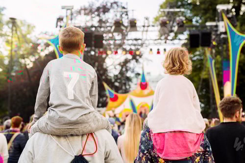 Preview: Boy and girl being carried on shoulders during festival