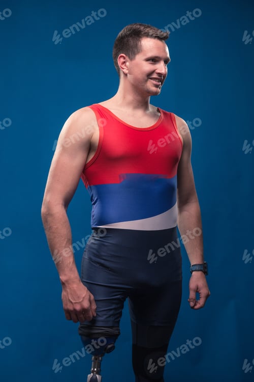Preview: Man Athlete Sportsman Portrait Posing, Disabled Prosthetic Leg, Blue Background, Sport Clothes