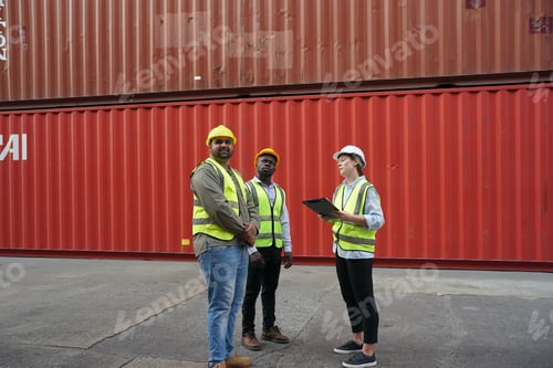 Preview: Foreman control loading Containers box from Cargo freight ship for import export.