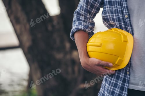 Preview: Engineer man hands holding hardhat white work helmet hard hat for Civil Construction Engineer