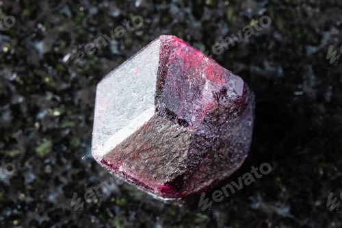 Preview: unpolished rhodolite pyrope crystal on black