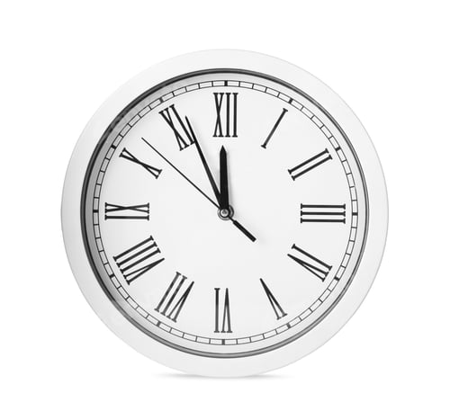 Preview: Clock showing five minutes until midnight isolated on white. New Year countdown