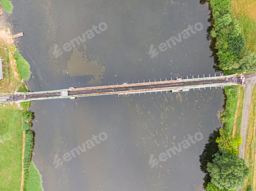 Preview: Scaffolding used for maintenance or restoration work on a small bridge over a large river the Cher