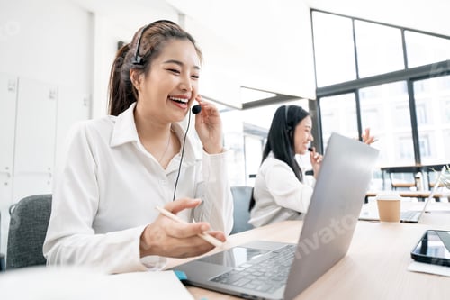 Preview: Happy smiling woman working in call center with her colleague
