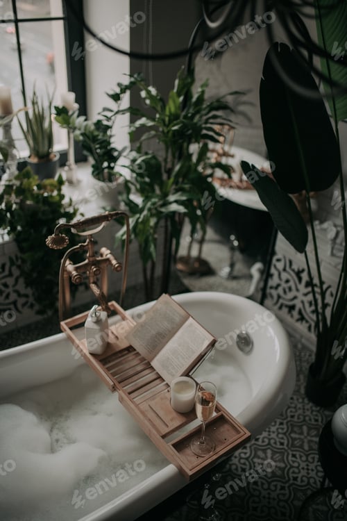 Preview: Luxurious interior bathroom in modern eco style with oval bathtub and book on bamboo wood tray