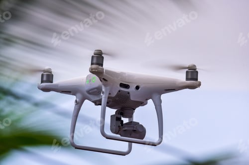 Preview: Drone is flying with digital camera to take photo and video on ground floor..